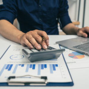 Young asian business man audit analysis graph company budget rep